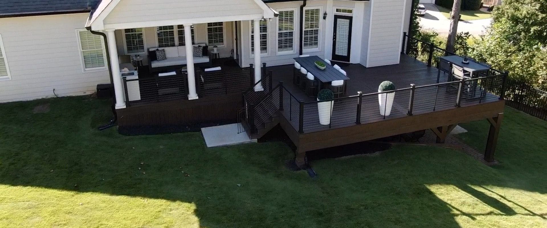Free-standing deck replacement with skirting and under deck system.
